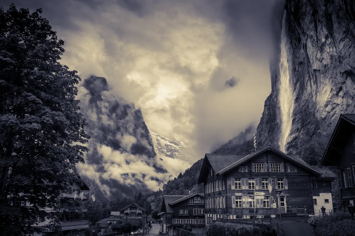 Staubbach Falls dropping off the cliff above Lauterbrunnen village