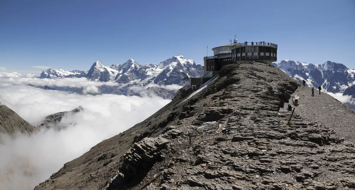 The Schilthorn summit with the Bernese Alps behind it