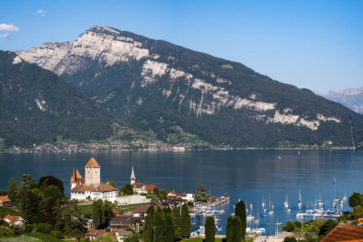 Spiez Castle and its harbour on the shore of Lake Thun